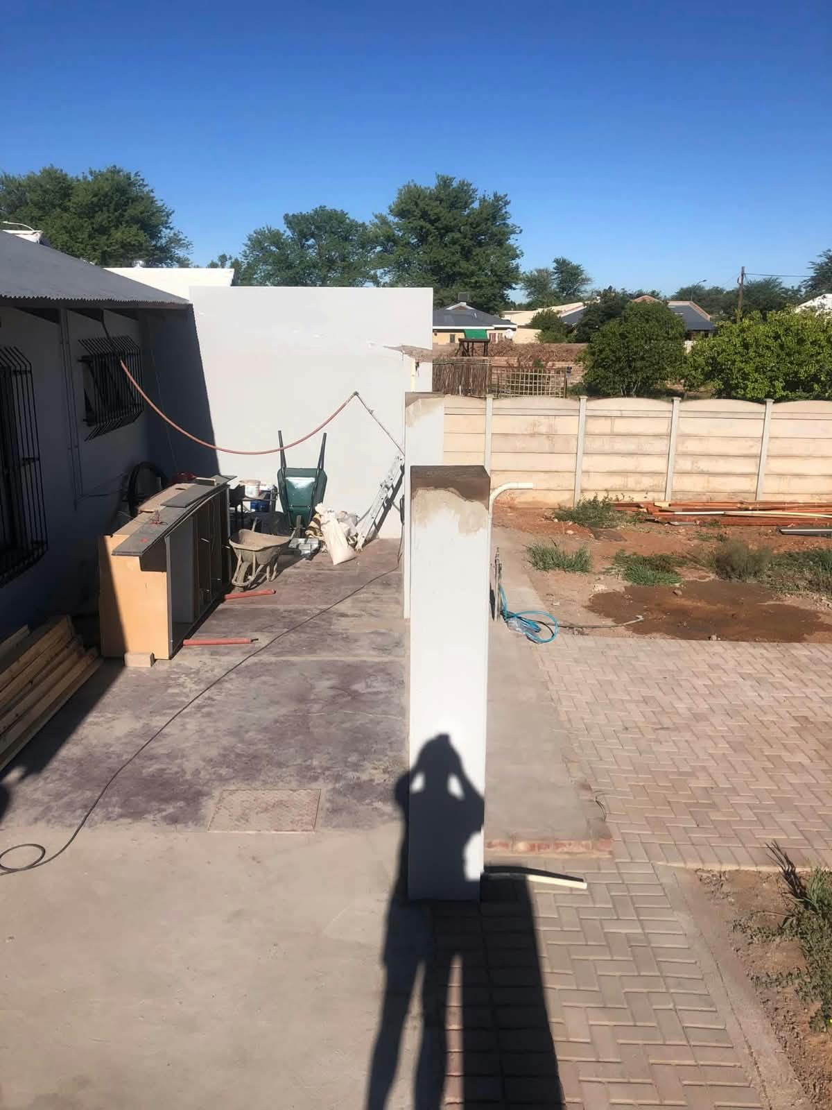 Paved residential driveway and patio area