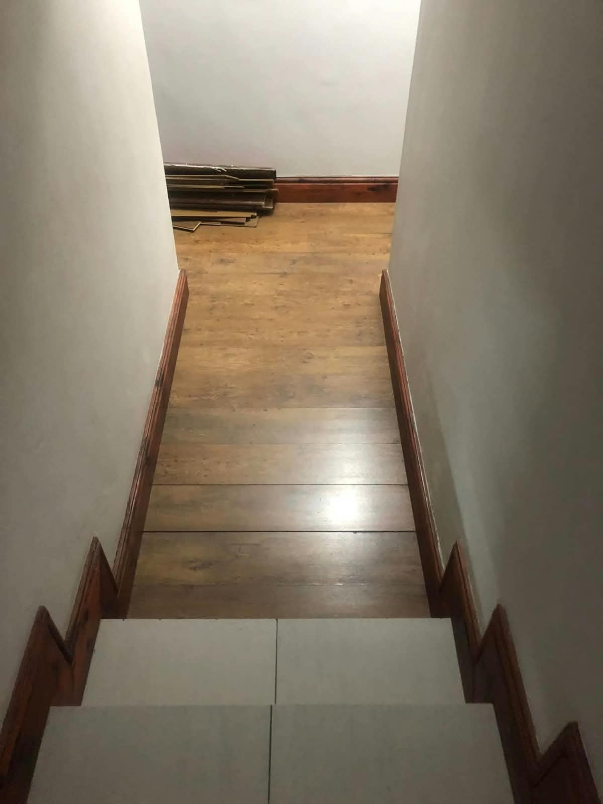 Completed wooden flooring installation in a hallway