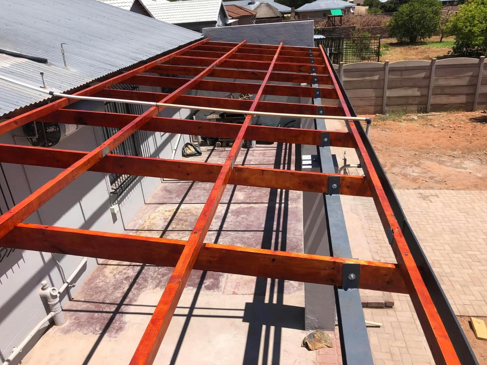 Steel and timber pergola frame under construction