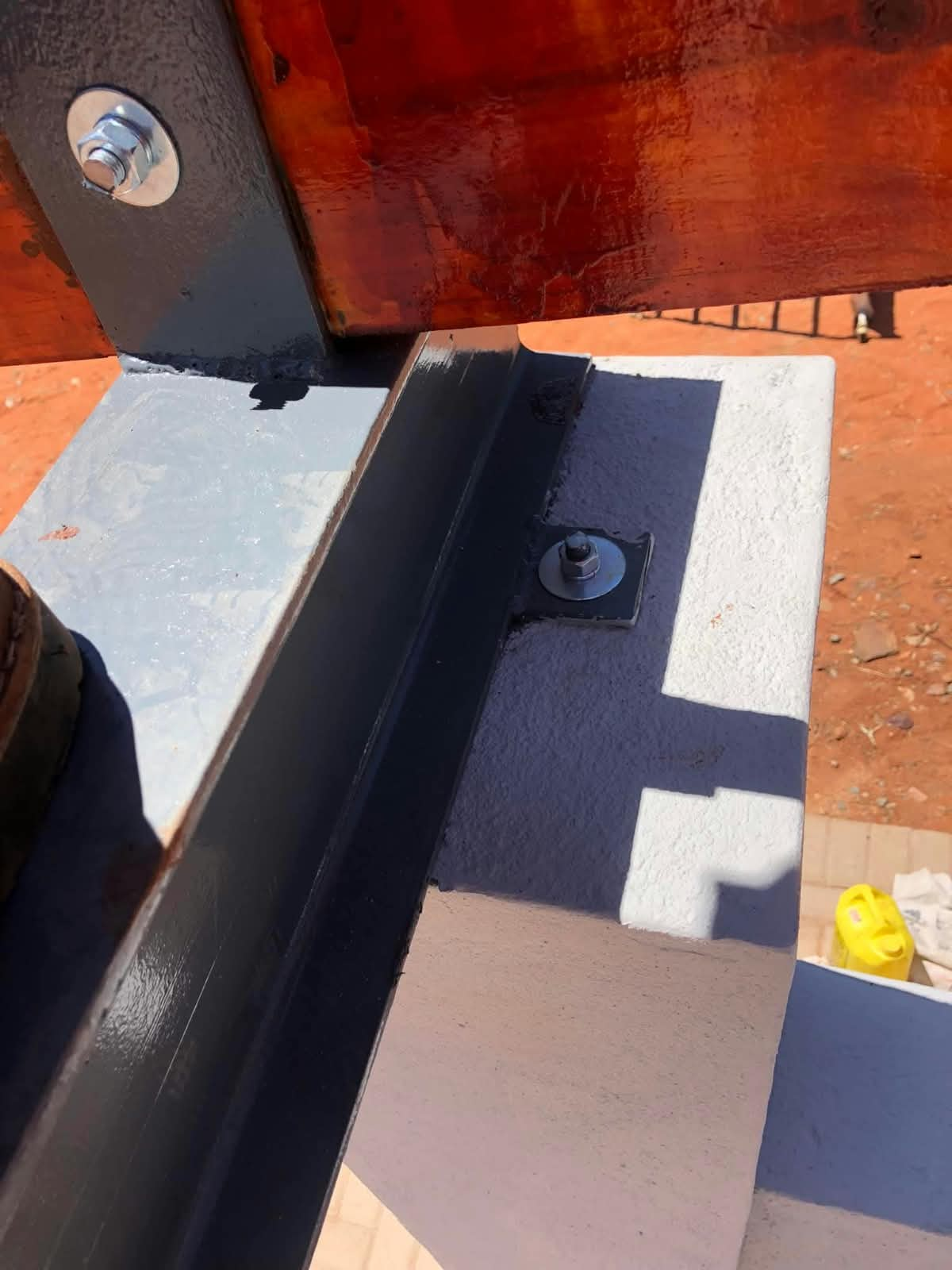 Steel bracket and bolt detail on a pergola post