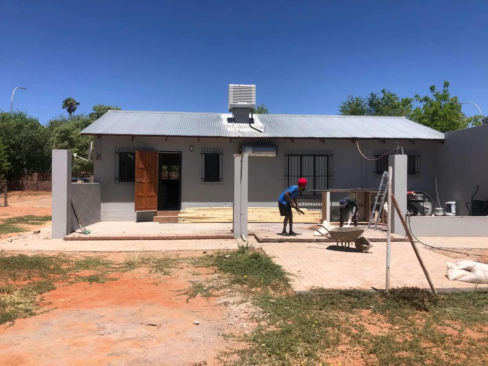 WBS RenCon team working on a house exterior in the Helderberg
